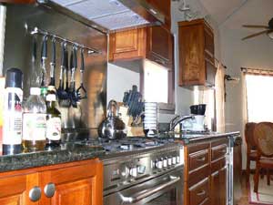 The kitchen has top appliances, including a huge Italian gas range.